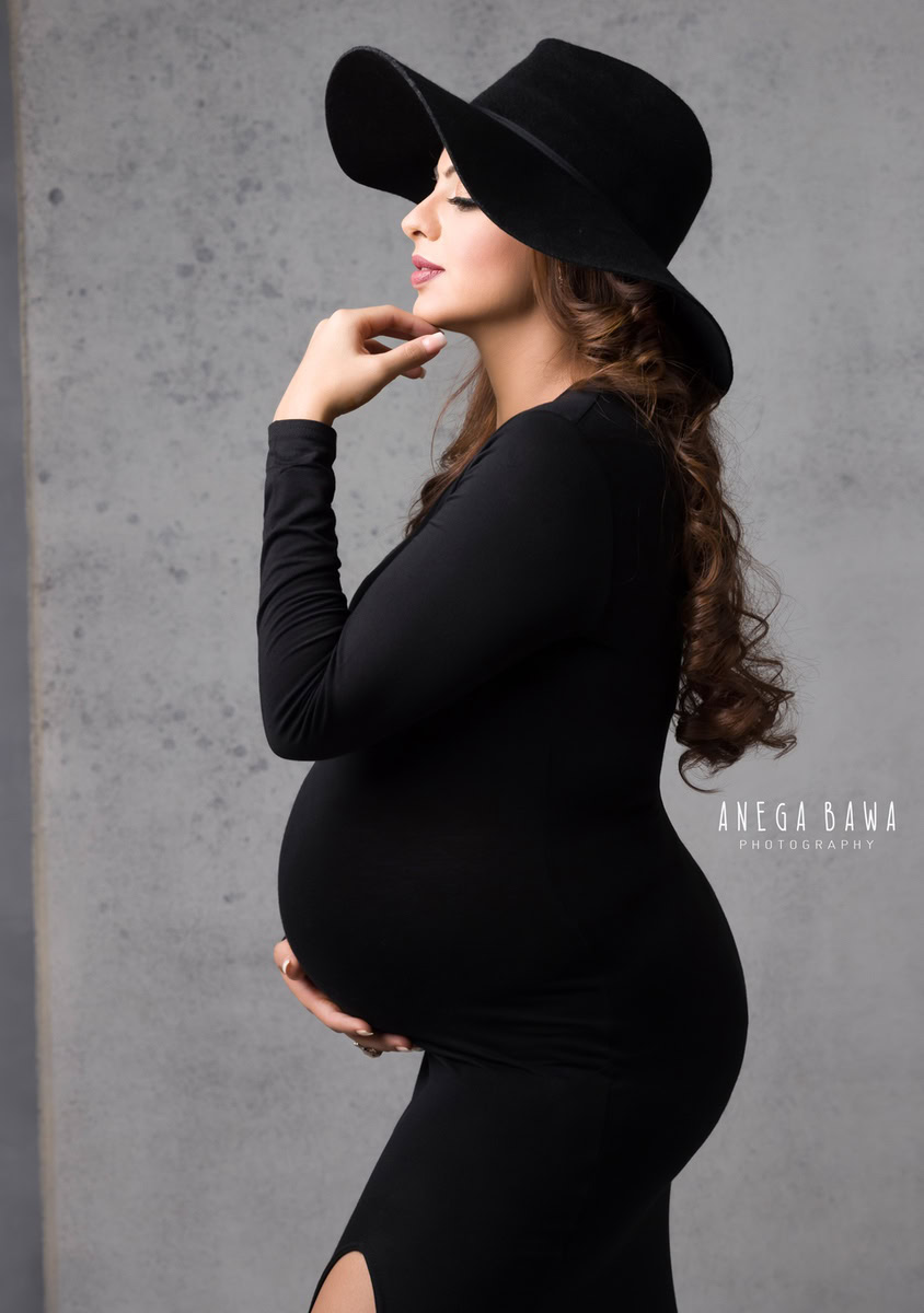 Best Pregnancy Shoot in Delhi: Black Slit with Hat, Grey Backdrop, by Anega Bawa Photography, Gurgaon Noida.