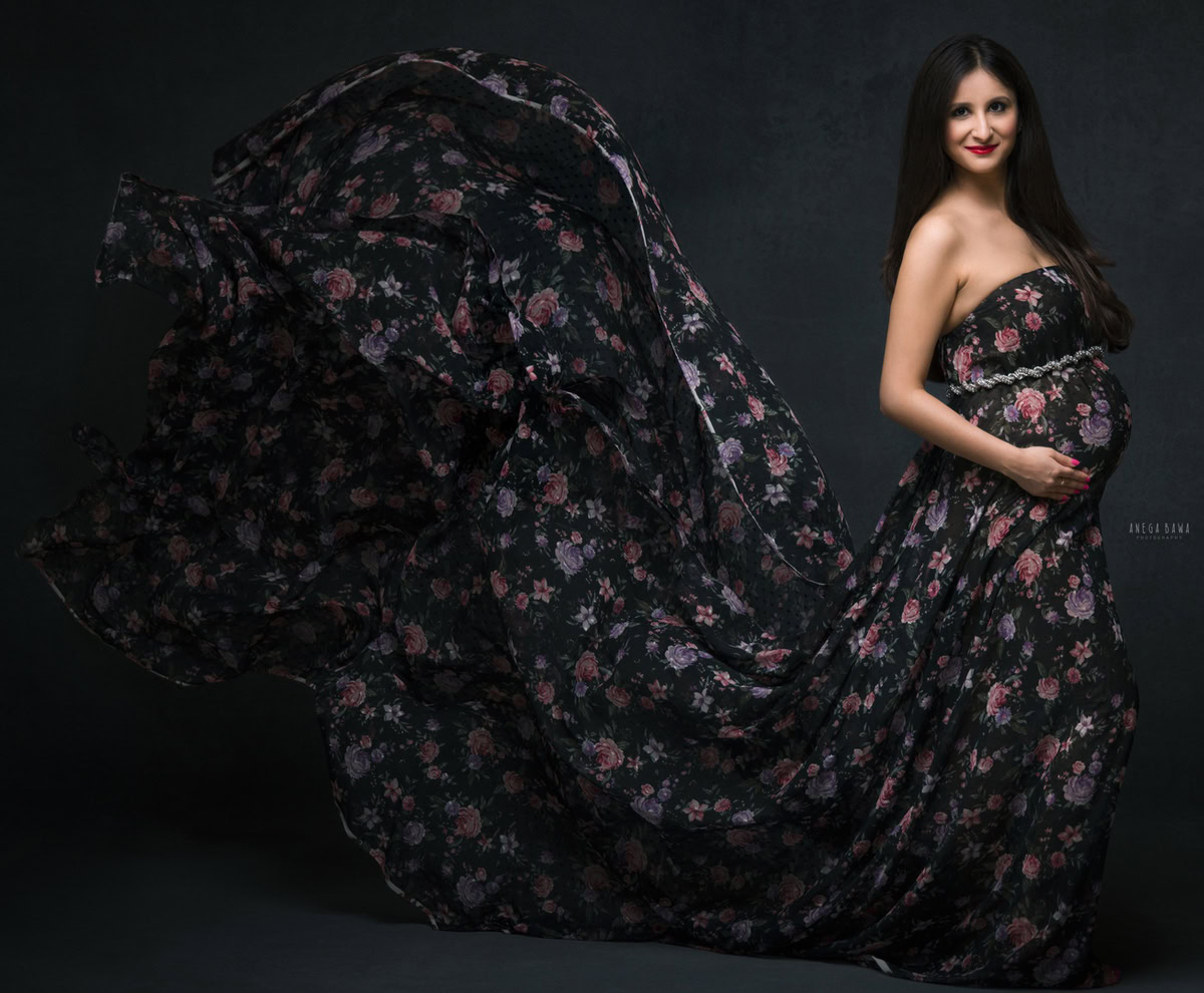 Maternity Photography in Delhi: Dark Floral Wrap, Black Backdrop, by Anega Bawa, Photographer Gurgaon Noida.