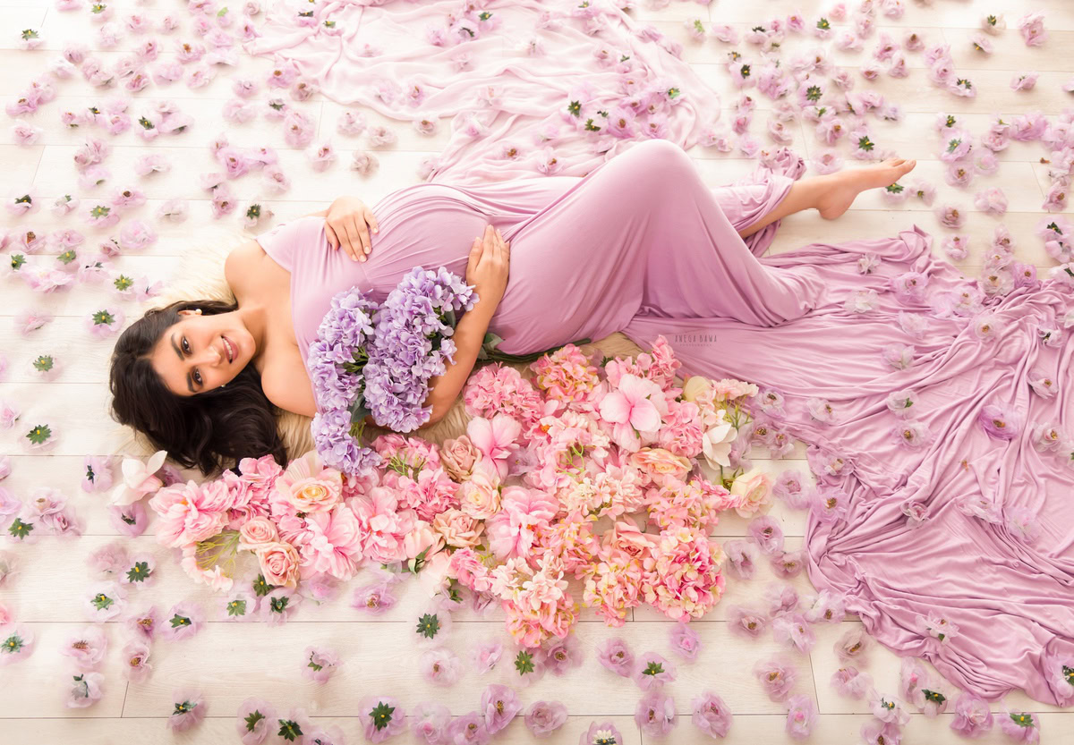 Maternity Photography in Delhi: Lavender Gown, Flowers, Lying Down, by Anega Bawa Photographer, Gurgaon Noida.
