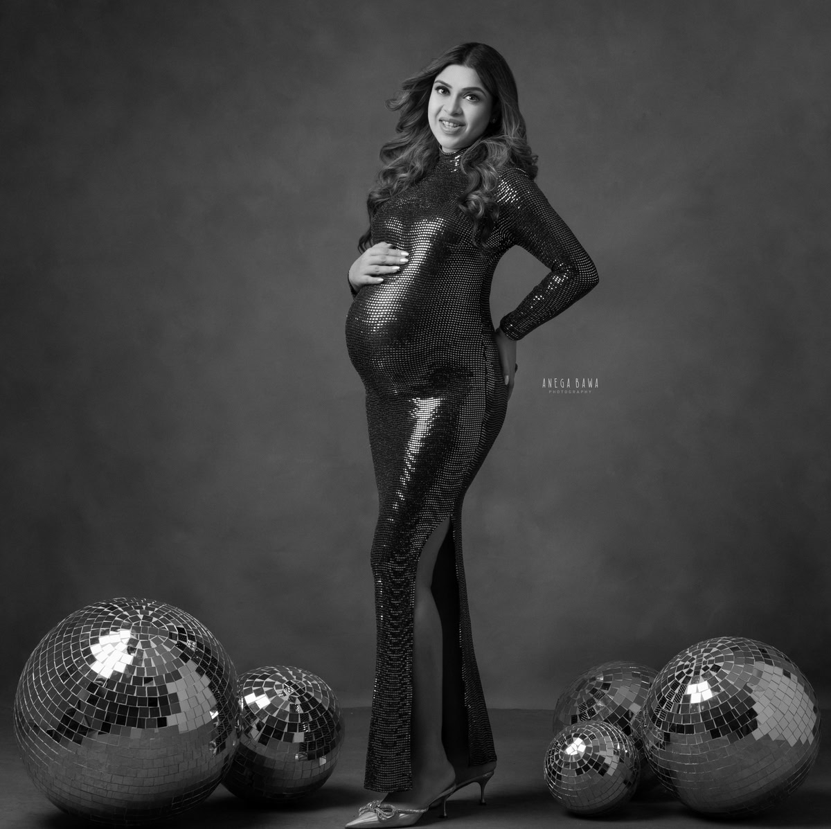 Maternity Photoshoot in Delhi: Black Shimmer Dress, Disco Balls, Grey Backdrop, by Anega Bawa Photography, Gurgaon Noida.