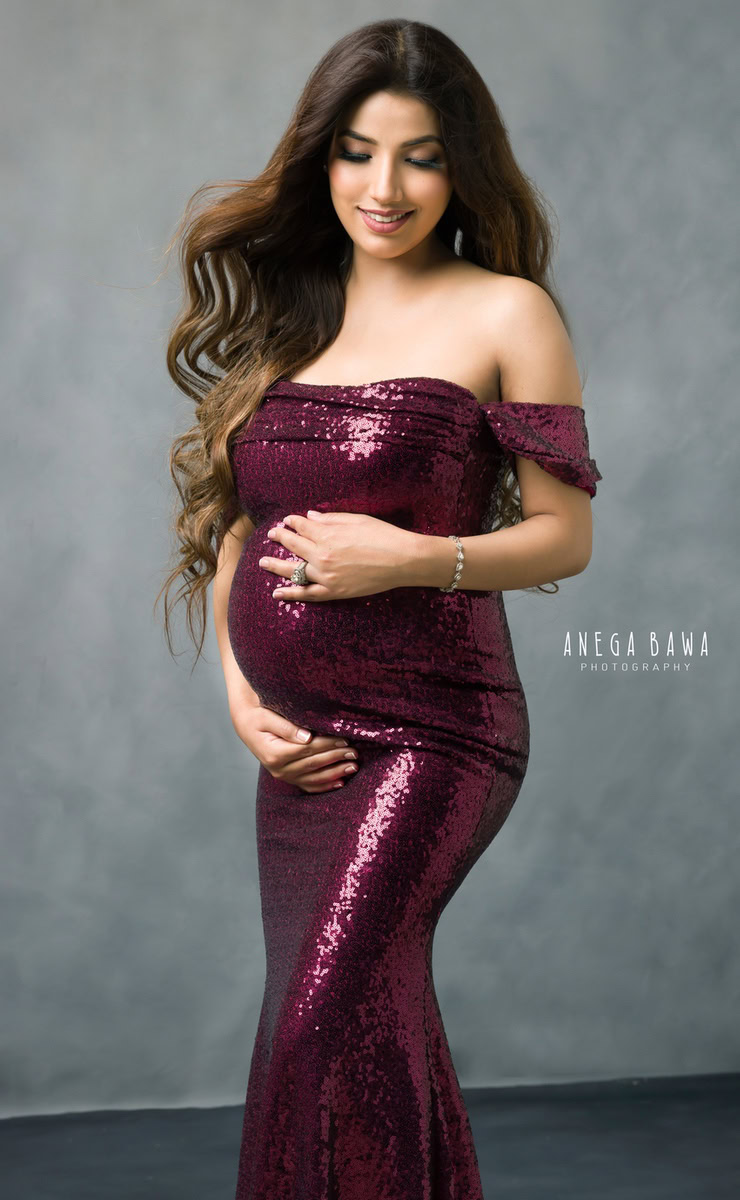 Maternity Photoshoot in Delhi: Dark Pink Shimmer Gown, Grey Backdrop, by Anega Bawa Photography, Gurgaon Noida.