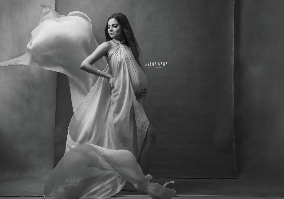 Maternity Photoshoot in Delhi: Golden Beige Wrap, Black and White Backdrop, by Anega Bawa Photography, Gurgaon Noida.
