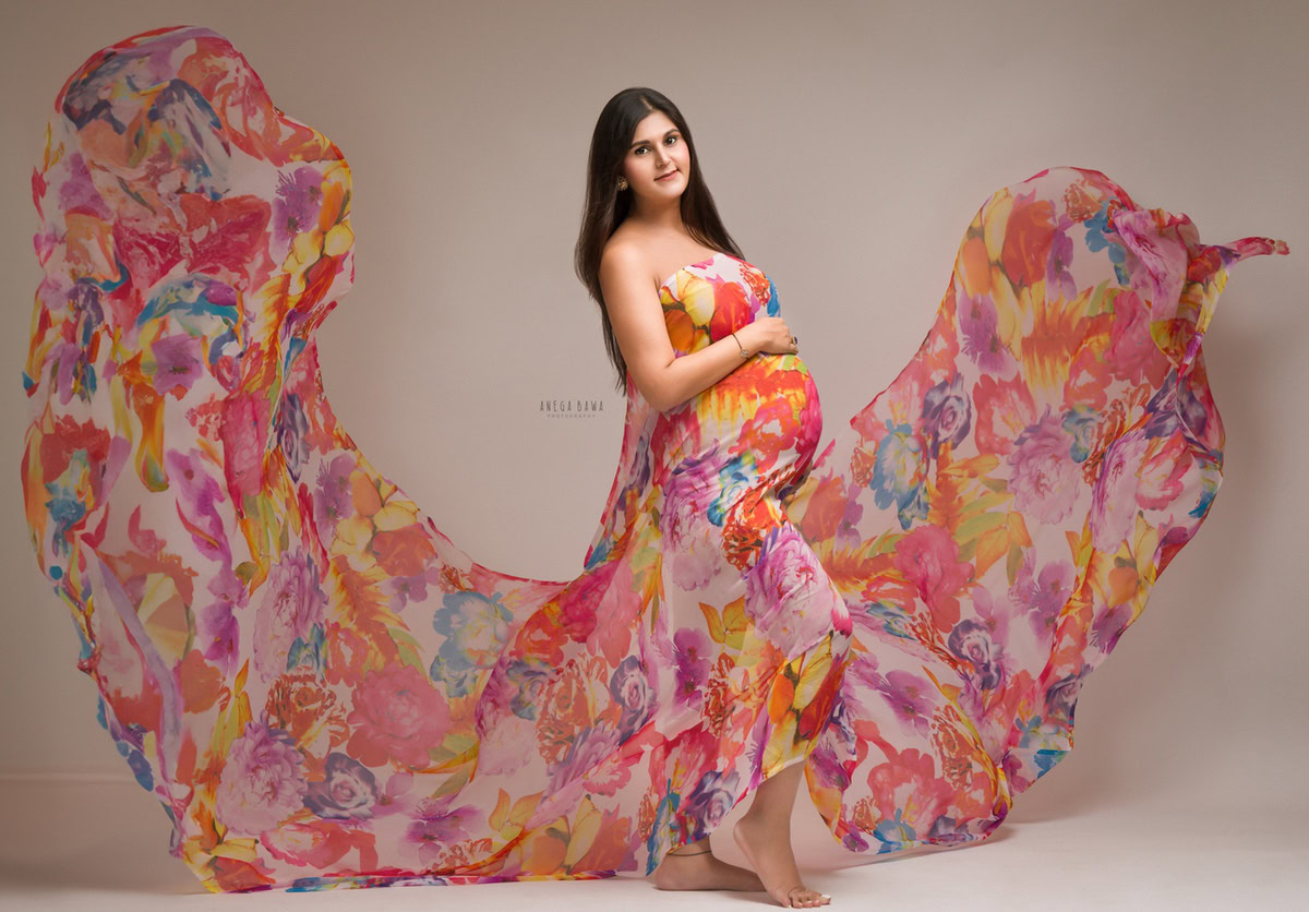 Maternity Photoshoot Delhi: Multi-colour Wrap Dress, Grey Backdrop, by Anega Bawa Photography, Gurgaon Noida.