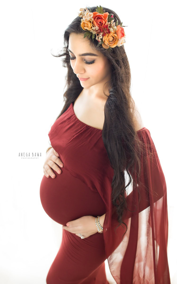 Maternity Photoshoot Delhi: Red Maroon Gown with Drape, Floral Headband by Anega Bawa Photography, Gurgaon Noida