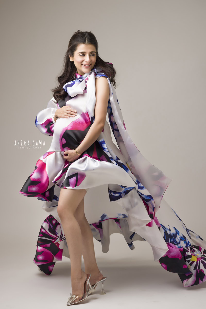 Maternity Shoot in Delhi: Floral Dress by Gauri & Nainika, Grey Backdrop, by Anega Bawa Photography, Gurgaon Noida.