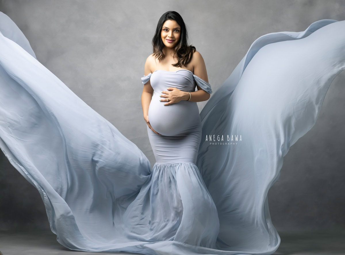 Maternity Shoot Delhi: Sky Blue Gown with Mega Sleeves and Drape, Grey Backdrop, by Anega Bawa Photography, Gurgaon Noida