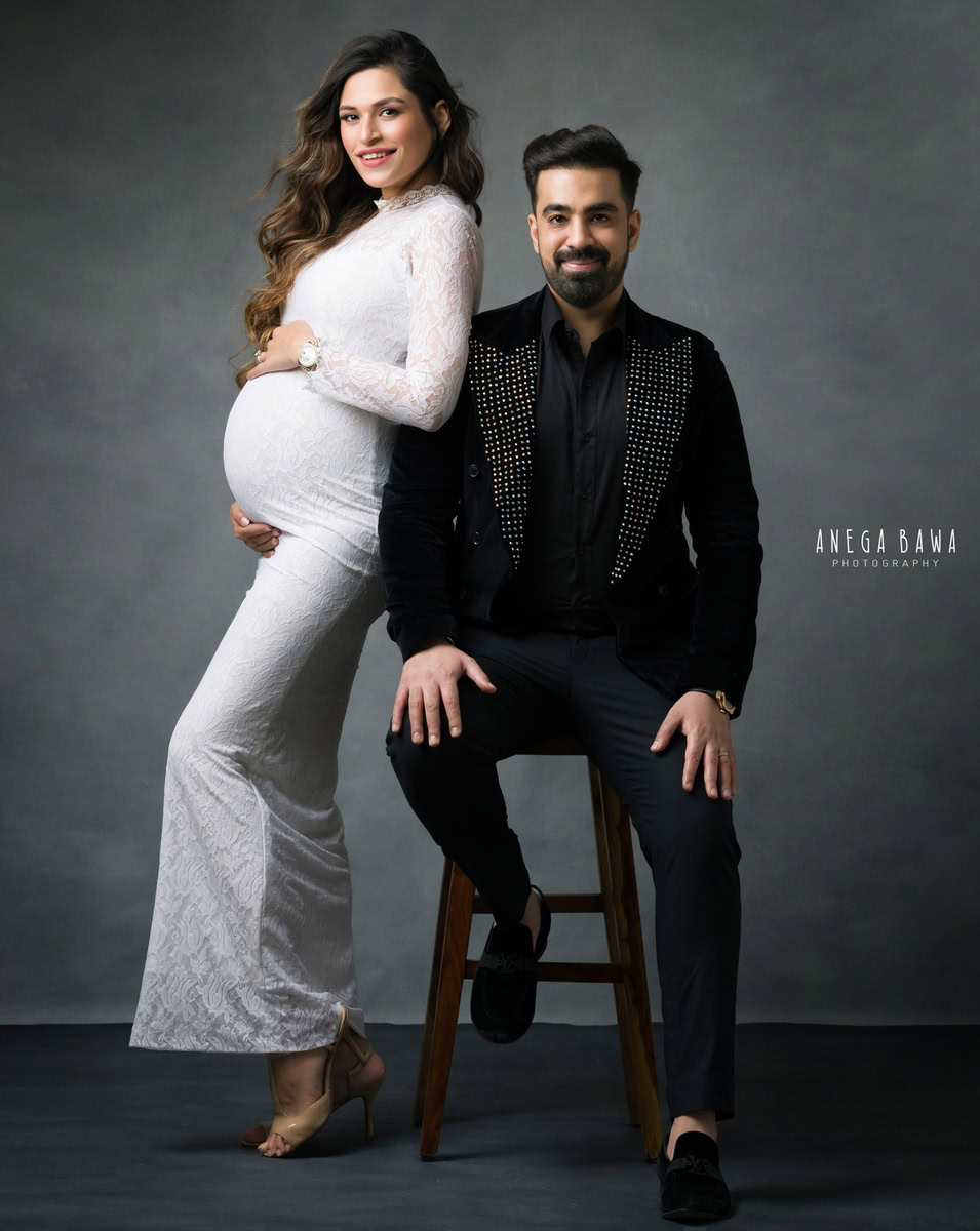 Maternity Shoot Delhi: White Bodycon Long Dress with Spouse, Grey Backdrop, by Anega Bawa Photography, Gurgaon Noida