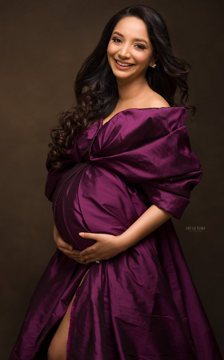 Pregnancy Photography in Delhi: Wine Raw Silk Wrap, Brown Backdrop by Anega Bawa Photography, Gurgaon Noida.