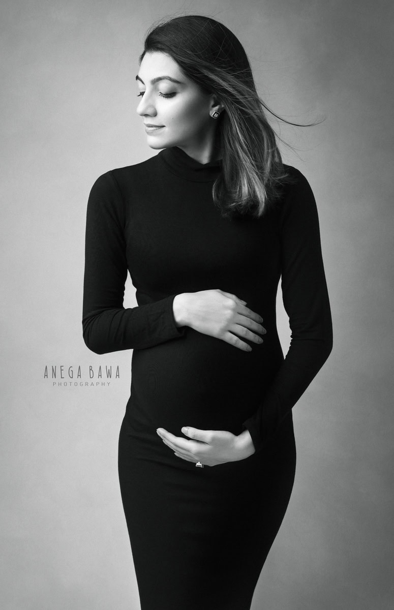 Pregnancy Photoshoot in Delhi: Black Bodycon, Grey Backdrop, by Anega Bawa Photography, Gurgaon Noida.