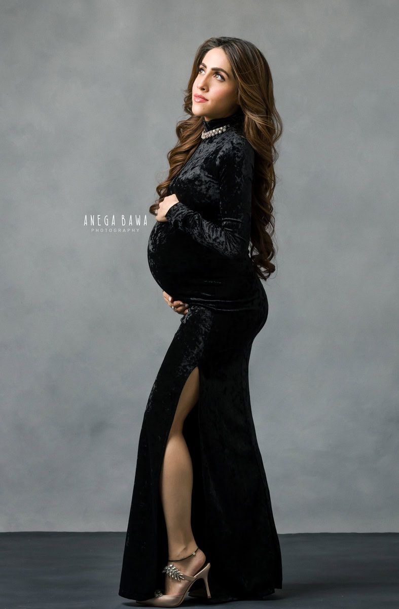Pregnancy Photoshoot in Delhi: Black Dress with High Slit, Grey Backdrop, by Anega Bawa Photography, Gurgaon Noida