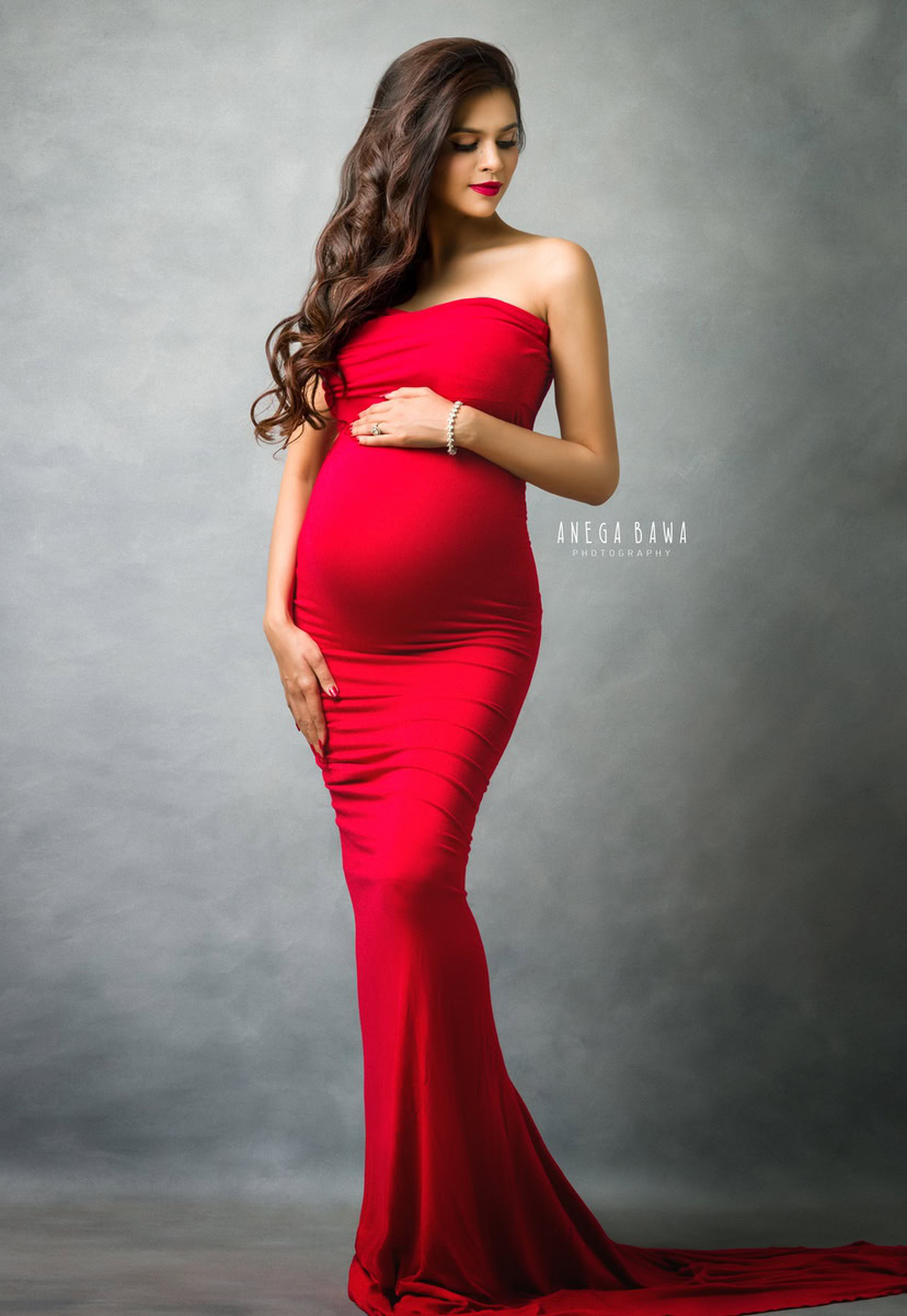 Pregnancy Photoshoot Delhi: Red Tube Gown, Grey Backdrop, by Anega Bawa Photography, Gurgaon Noida.
