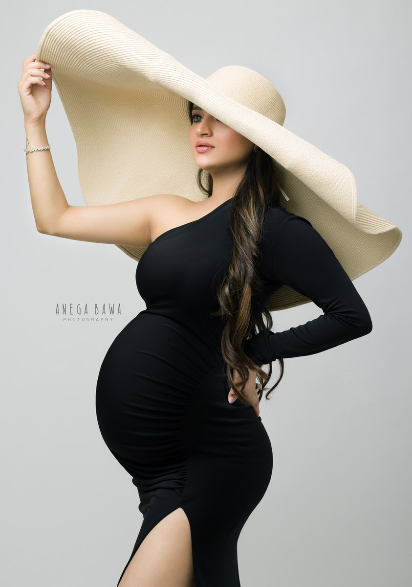 Pregnancy Shoot in Delhi: Black One-Shoulder with Hat, by Anega Bawa Photography, Gurgaon Noida.