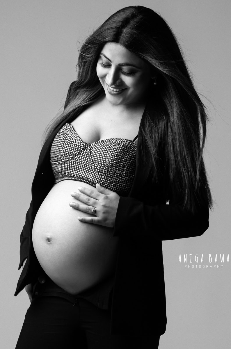 Pregnancy Shoot in Delhi: Black Suit with Bralette, Grey Backdrop, by Anega Bawa Photography, Gurgaon Noida.