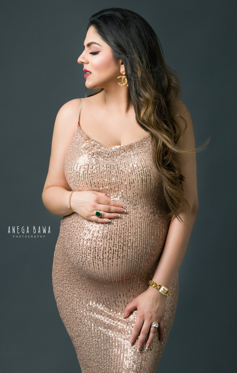 Pregnancy Shoot in Delhi: Golden Shimmer Strap Gown, Grey Backdrop, by Anega Bawa Photography, Gurgaon Noida.