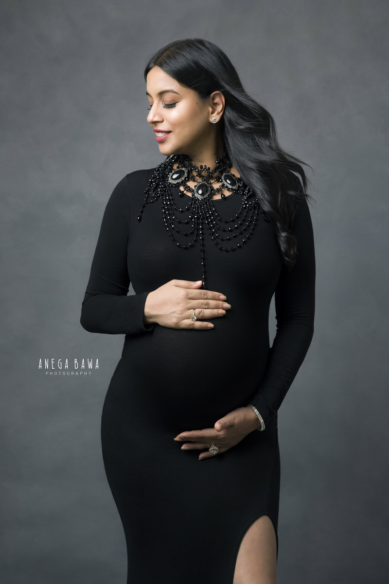 Top Maternity Shoot in Delhi: Black High Slit, Grey Backdrop, by Anega Bawa Photography, Gurgaon Noida.