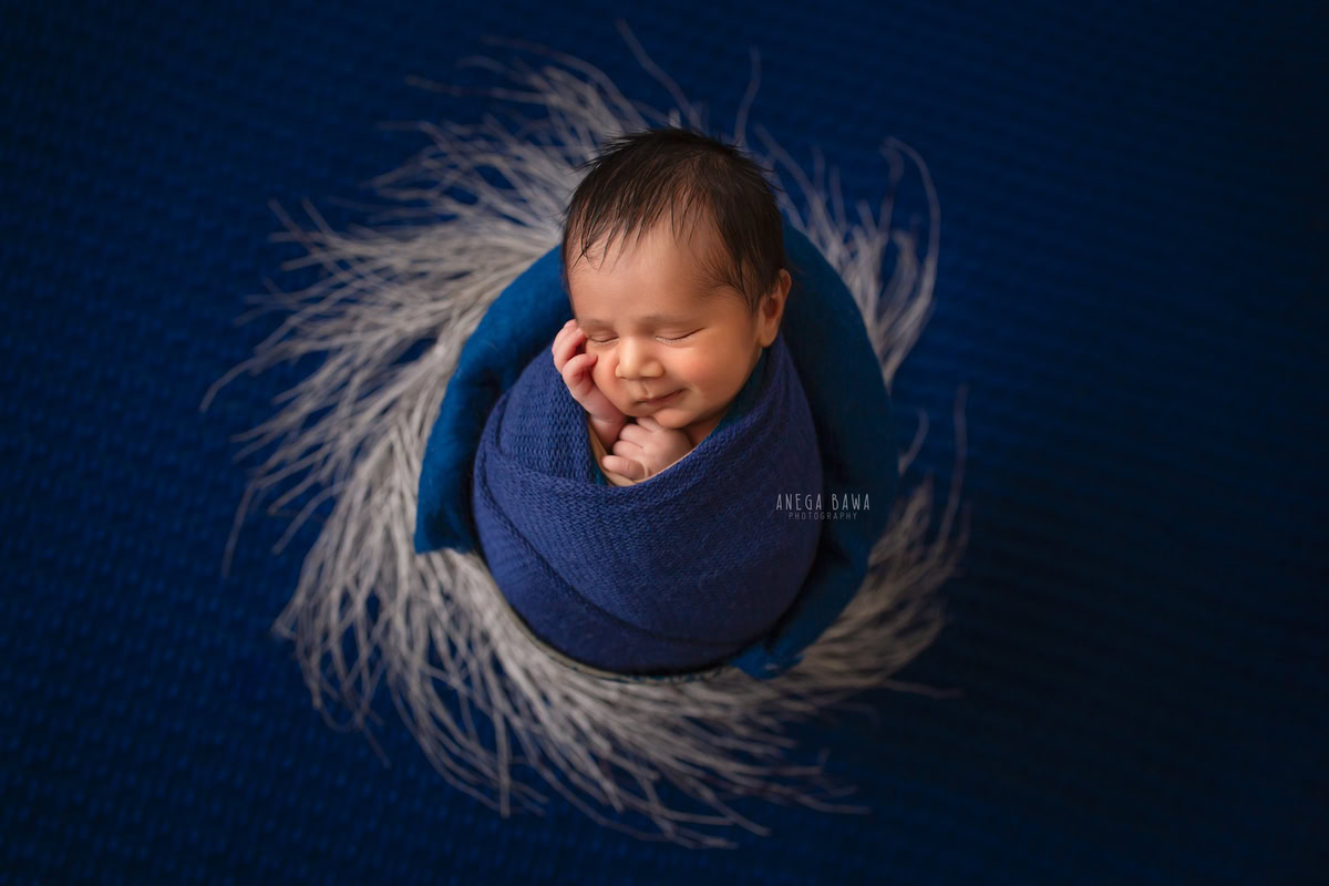 Newborn Photographer in Delhi: Blue Wrap with Blue Backdrop, by Anega Bawa Photography, Gurgaon Noida.