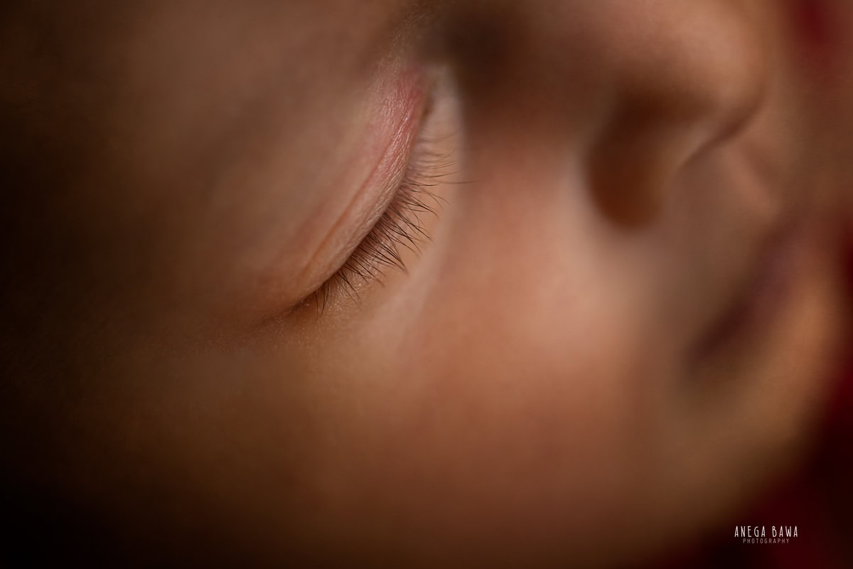 Newborn Photography in Delhi: Close-up of adorable eyelashes photographed by Anega Bawa in Gurgaon Noida.