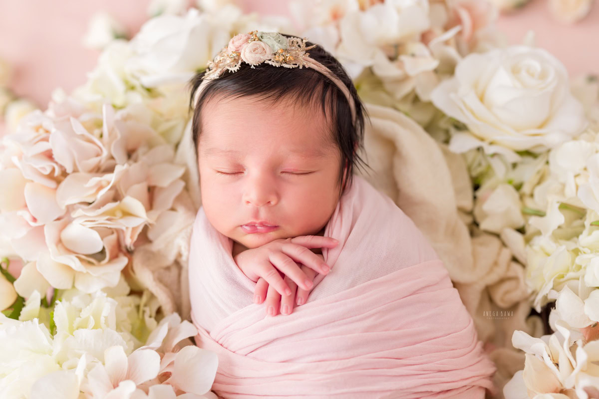 Newborn Photographer in Delhi: Pink Wrap with Cute Headband and Flowers, by Anega Bawa Photography, Gurgaon Noida.
