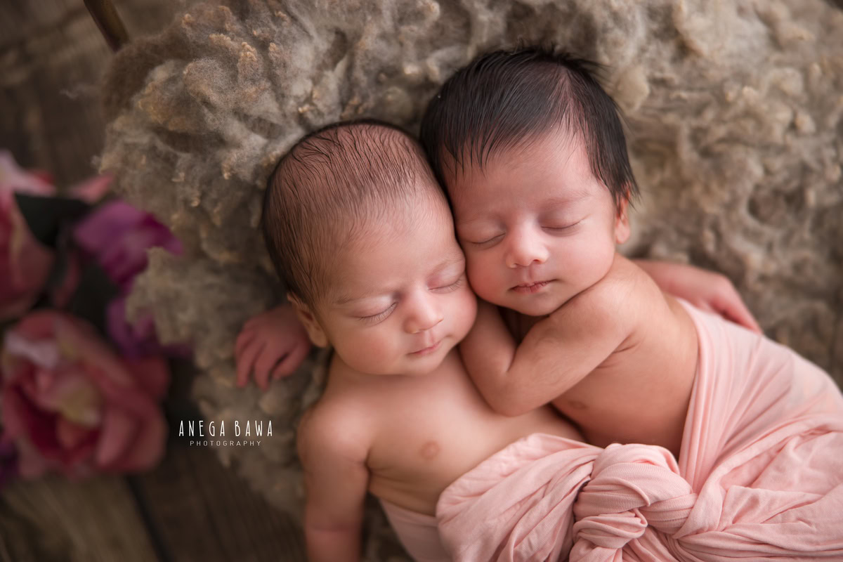 Newborn Photographer in Delhi: Twins in Pink Wrap, Sleeping Pose, Grey Rug, by Anega Bawa Photography, Gurgaon Noida.