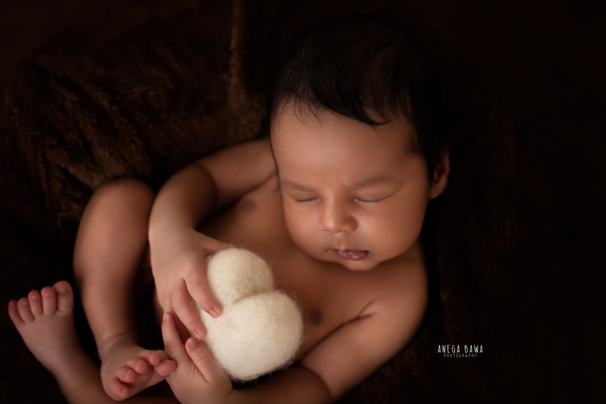 Newborn Photography in Delhi: Black Backdrop, Soft Toy, by Anega Bawa Photographer, Gurgaon Noida.