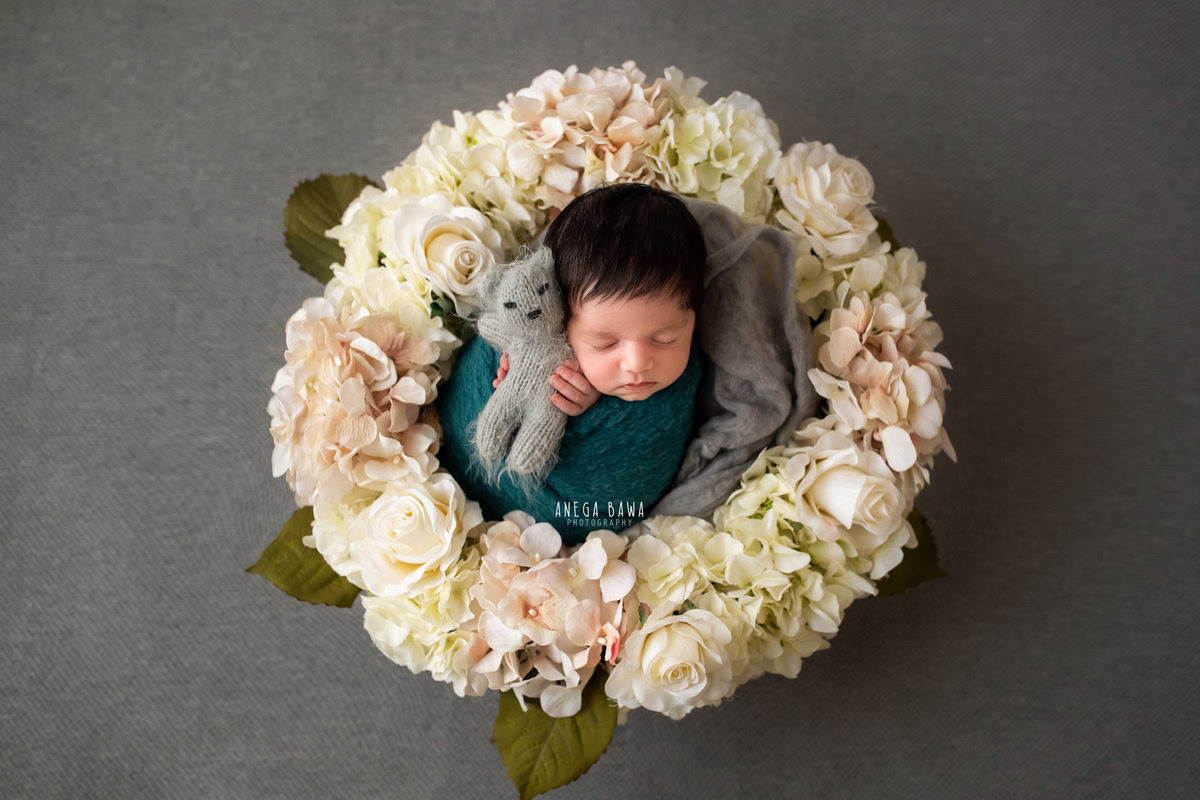 Newborn Photography in Delhi: Blue Wrap, Grey Soft Toy, Grey Backdrop, White Floral Basket, by Anega Bawa Photographer, Gurgaon Noida.