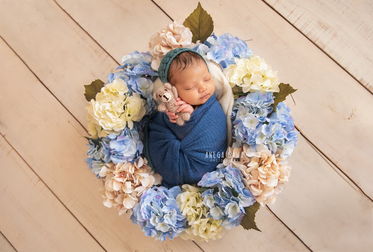 Newborn Photography in Delhi: Blue Wrap, Soft Toy, Floral Basket, Beige Backdrop, by Anega Bawa Photographer, Gurgaon Noida.