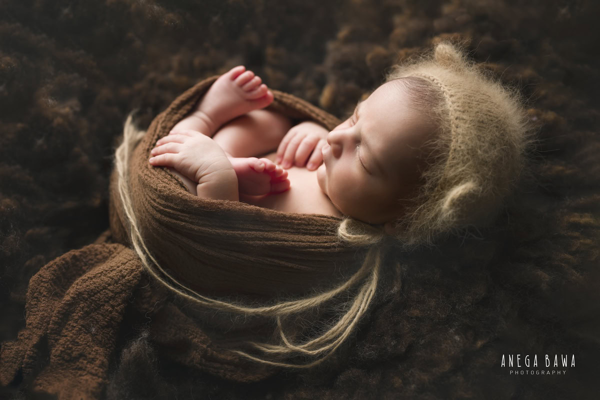 Newborn Photography in Delhi: Brown Cap, Brown Rug, Sleeping Pose, Brown Backdrop, by Anega Bawa Photographer, Gurgaon Noida.