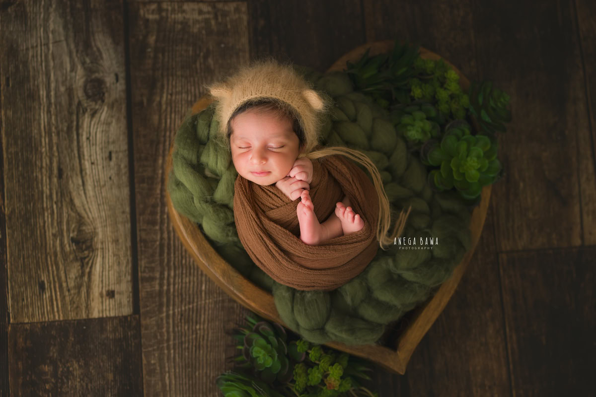 Newborn Photography in Delhi: Brown Wrap, Beige Cap, Brown Backdrop, by Anega Bawa Photographer, Gurgaon Noida.