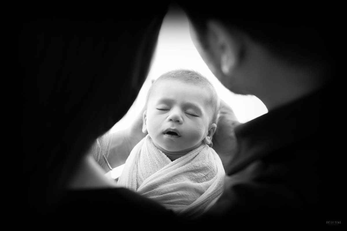 Newborn Photography in Delhi: Family portrait in black and white captured by Anega Bawa Photography in Gurgaon.