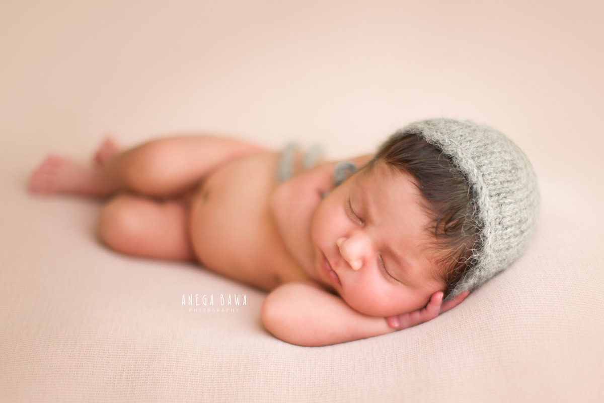 Newborn Photography in Delhi: Grey Cap, Sleeping Pose, by Anega Bawa Photographer, Gurgaon Noida.