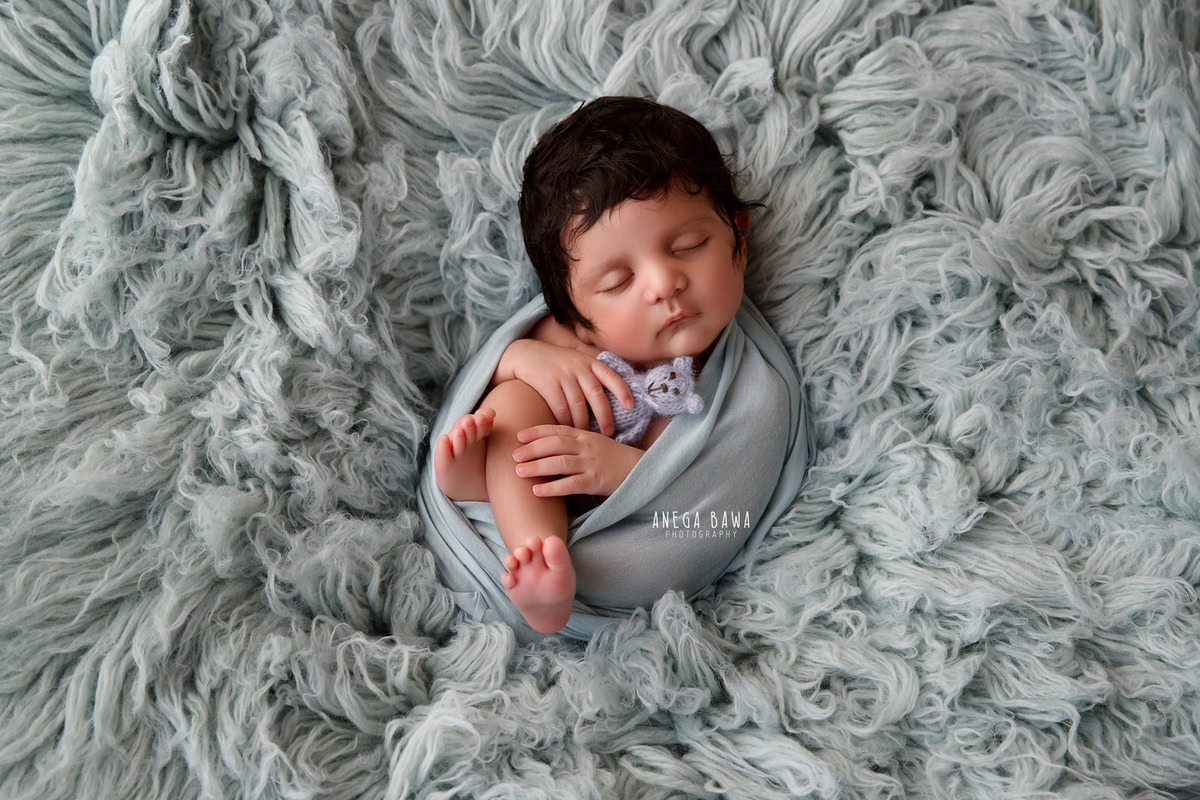 Newborn Photography in Delhi: Grey Wrap, Grey Rug, Soft Toy, by Anega Bawa Photographer, Gurgaon Noida.