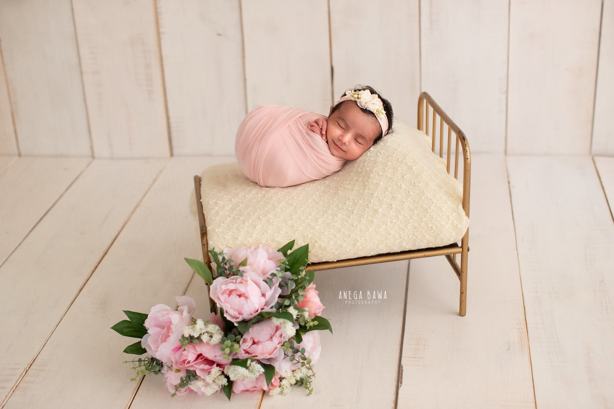 Newborn Photography in Delhi: Pink Wrap, Beige Backdrop, Cute Headband, by Anega Bawa Photographer, Gurgaon Noida.