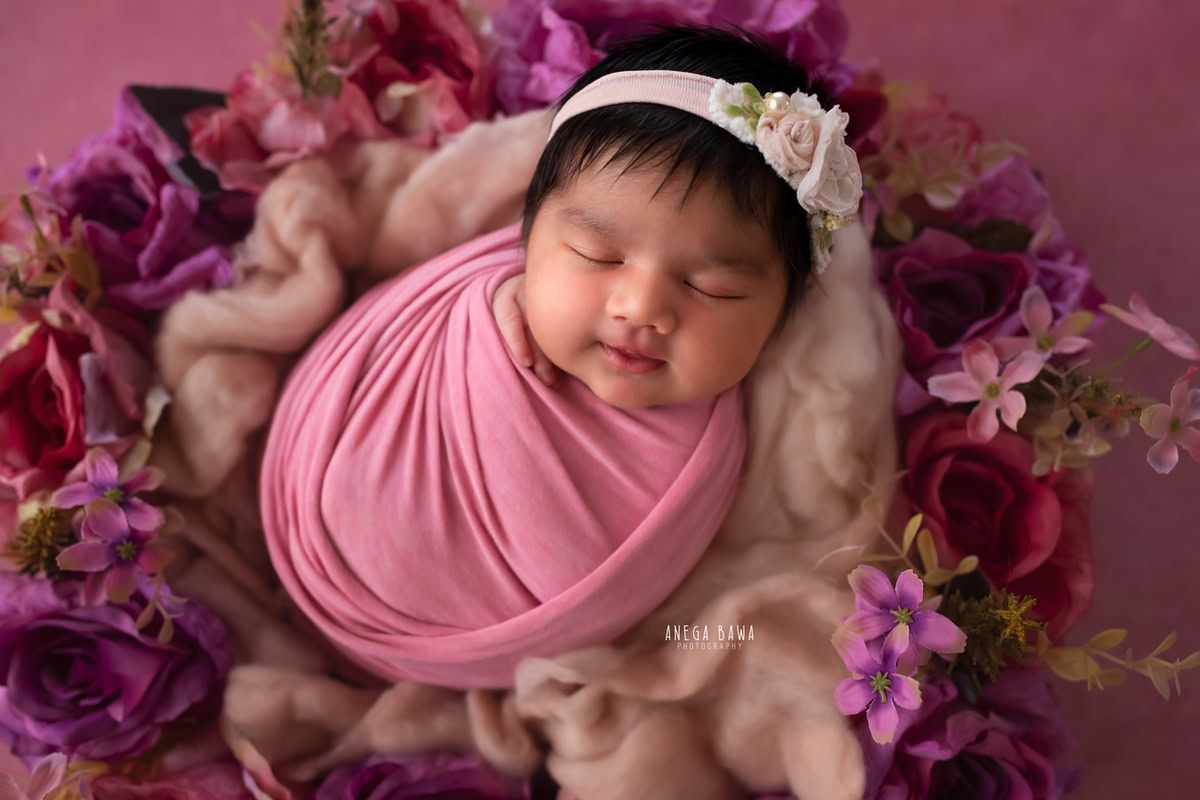 Newborn Photography in Delhi: Pink Wrap, Floral Basket, Pink Backdrop, by Anega Bawa Photographer, Gurgaon Noida.