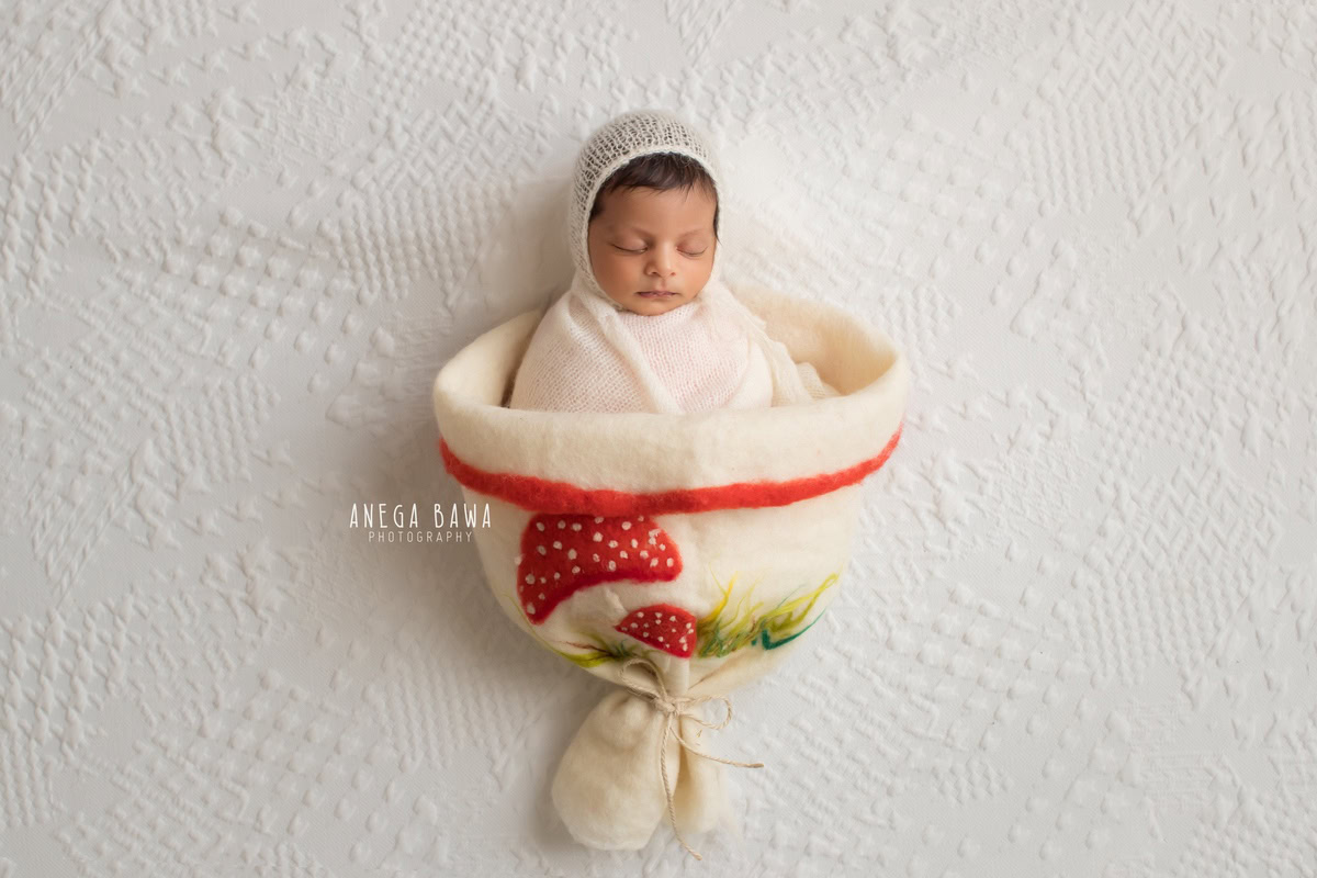Newborn Photography in Delhi: Strawberry White Wrap, White Cap, White Backdrop, by Anega Bawa Photographer, Gurgaon Noida.