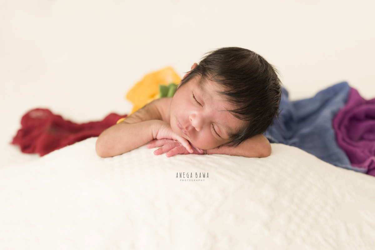 Newborn Photography in Delhi: Sleeping Pose on White Backdrop, by Anega Bawa Photographer, Gurgaon Noida.