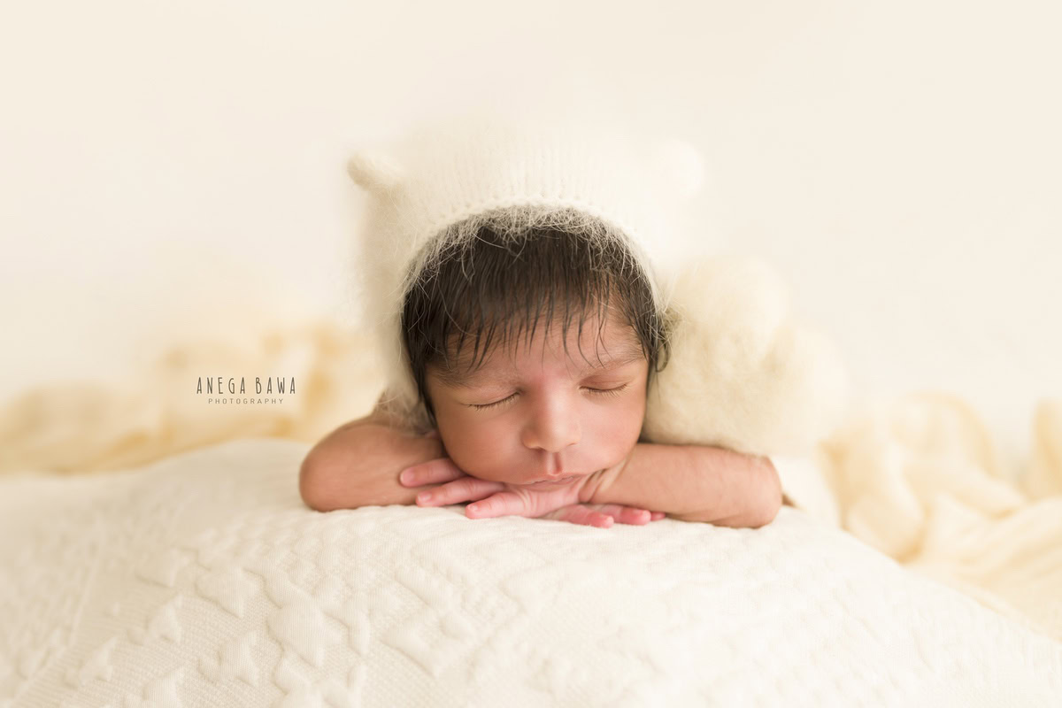 Newborn Photography in Delhi: White Rabbit Cap on White Backdrop, by Anega Bawa Photographer, Gurgaon Noida.