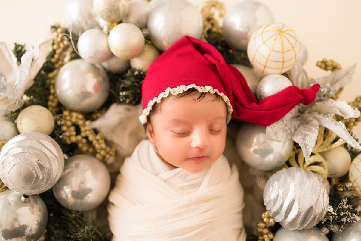 Newborn Photography in Delhi: White Wrap with Santa Cap, by Anega Bawa Photographer, Gurgaon Noida.