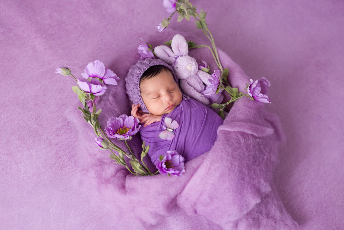Newborn Photography at Home in Delhi: Purple Wrap with Lavender Backdrop. Photographer: Anega Bawa, Gurgaon Noida.