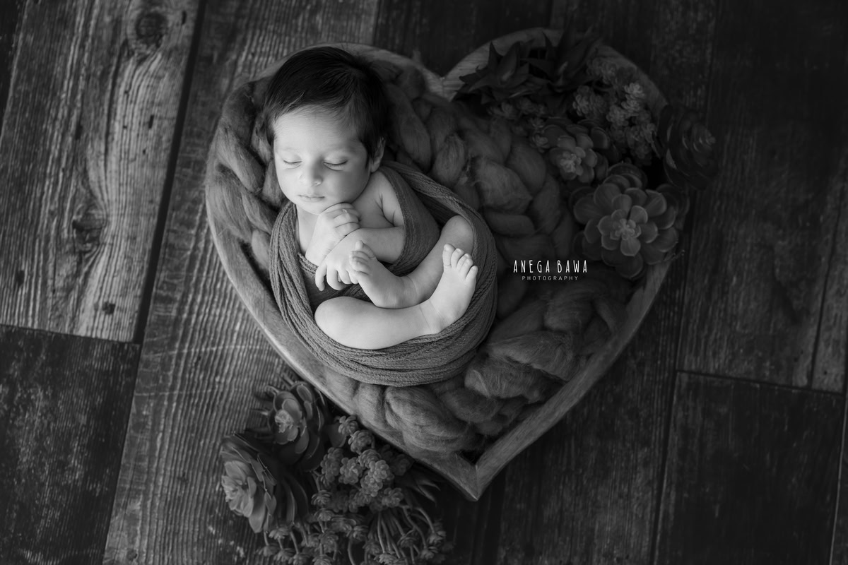 Newborn Photoshoot in Gurgaon: Brown Wrap with Black and White Accents. Photographer: Anega Bawa, Delhi Noida.