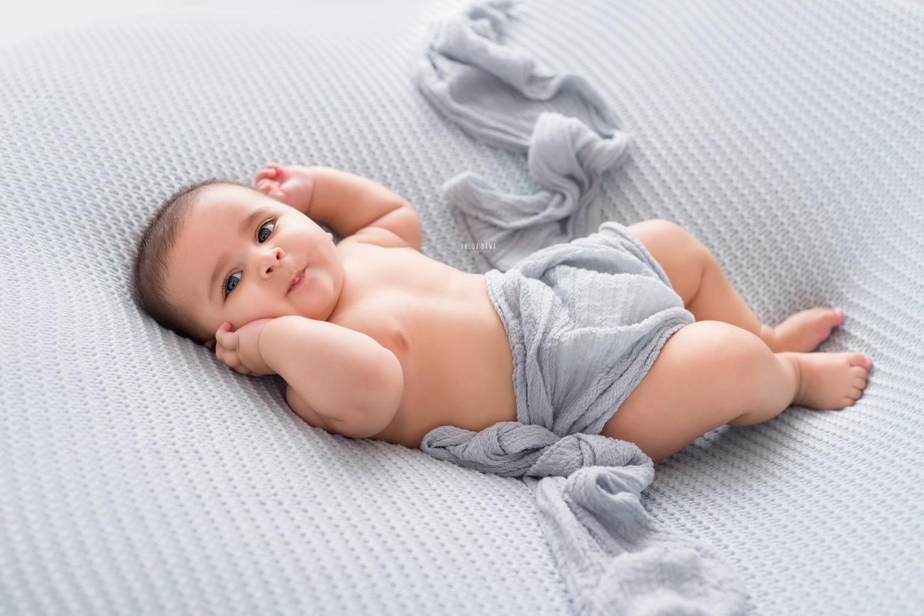 Baby boy photo shoot, 6, 5, 3, or 4 months, grey wrap, grey backdrop. Location: Delhi, Gurgaon, Noida. Photographer: Anega Bawa.