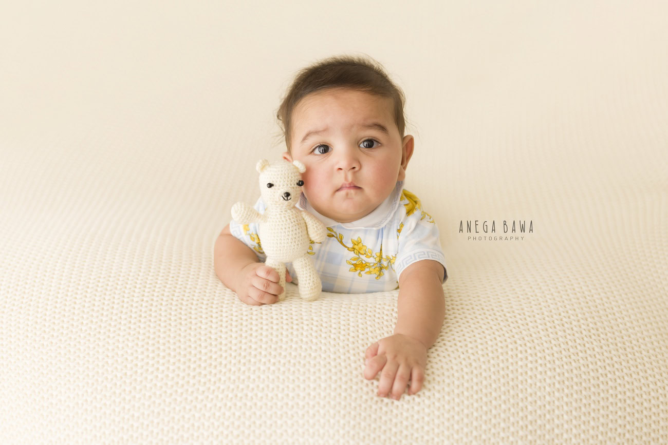 Baby boy photo shoot, 6, 5, 3, or 4 months, white backdrop, soft toy. Location: Delhi, Gurgaon, Noida. Photographer: Anega Bawa.