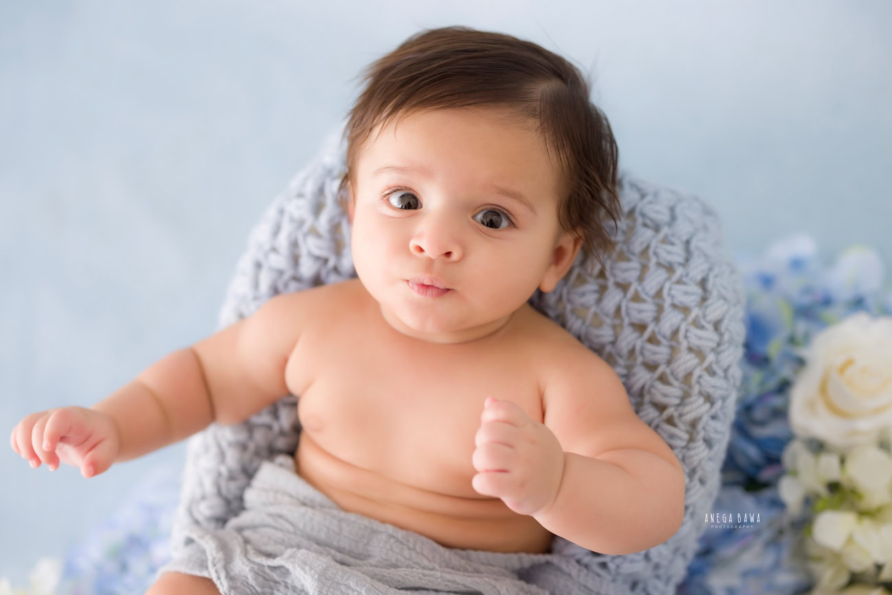 Baby boy photographer, 6 or 4 or 3 or 5 months, grey backdrop, grey sheet. Location: Delhi, Gurgaon, Noida. Photographer: Anega Bawa.