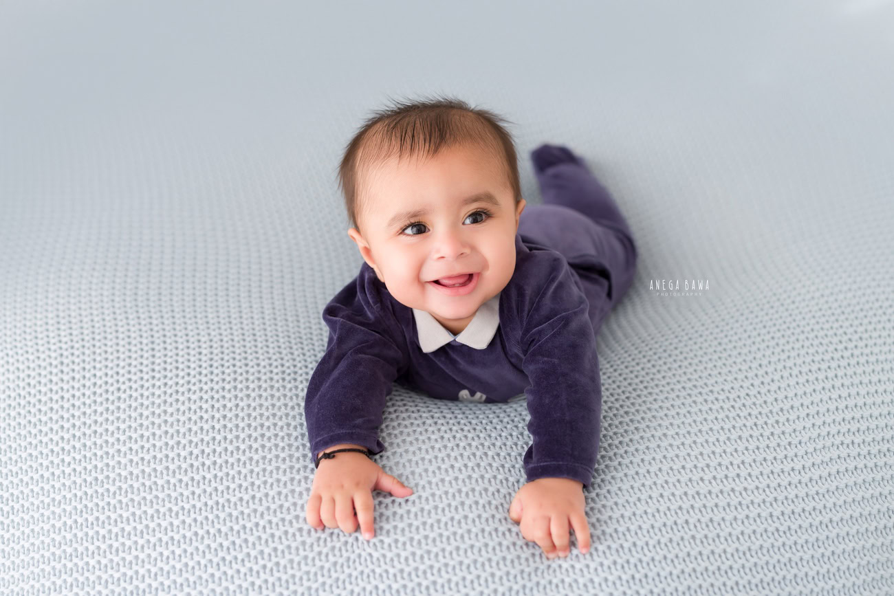 Baby boy photography, 5 or 4 or 3 or 6 months, blue baby boy suit, grey backdrop. Location: Delhi, Gurgaon, Noida. Photographer: Anega Bawa.
