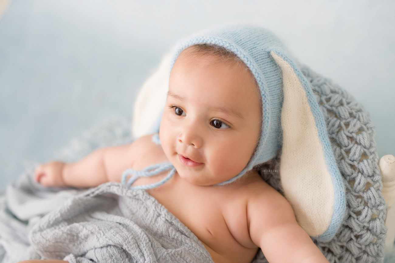 Baby boy photography, 5, 4, 3, or 6 months, cute cap, grey backdrop. Location: Delhi, Gurgaon, Noida. Photographer: Anega Bawa.