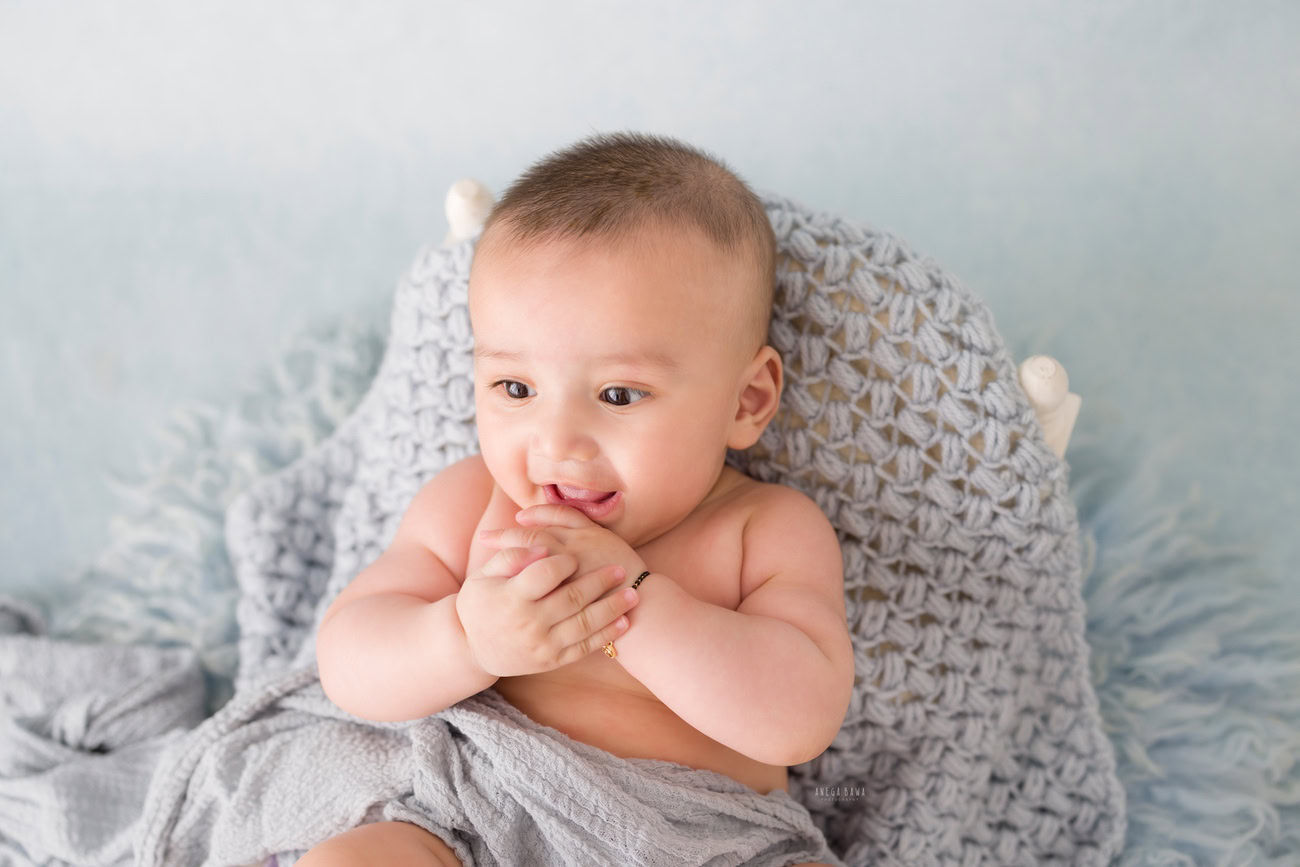 Baby boy photography, 5, 4, 3, or 6 months, grey wrap, grey backdrop. Location: Delhi, Gurgaon, Noida. Photographer: Anega Bawa.