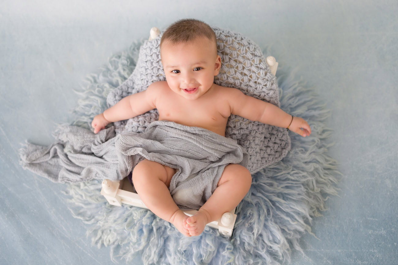 Baby boy photography, 5, 4, 3, or 6 months, grey wrap, grey backdrop. Location: Delhi, Gurgaon, Noida. Photographer: Anega Bawa.