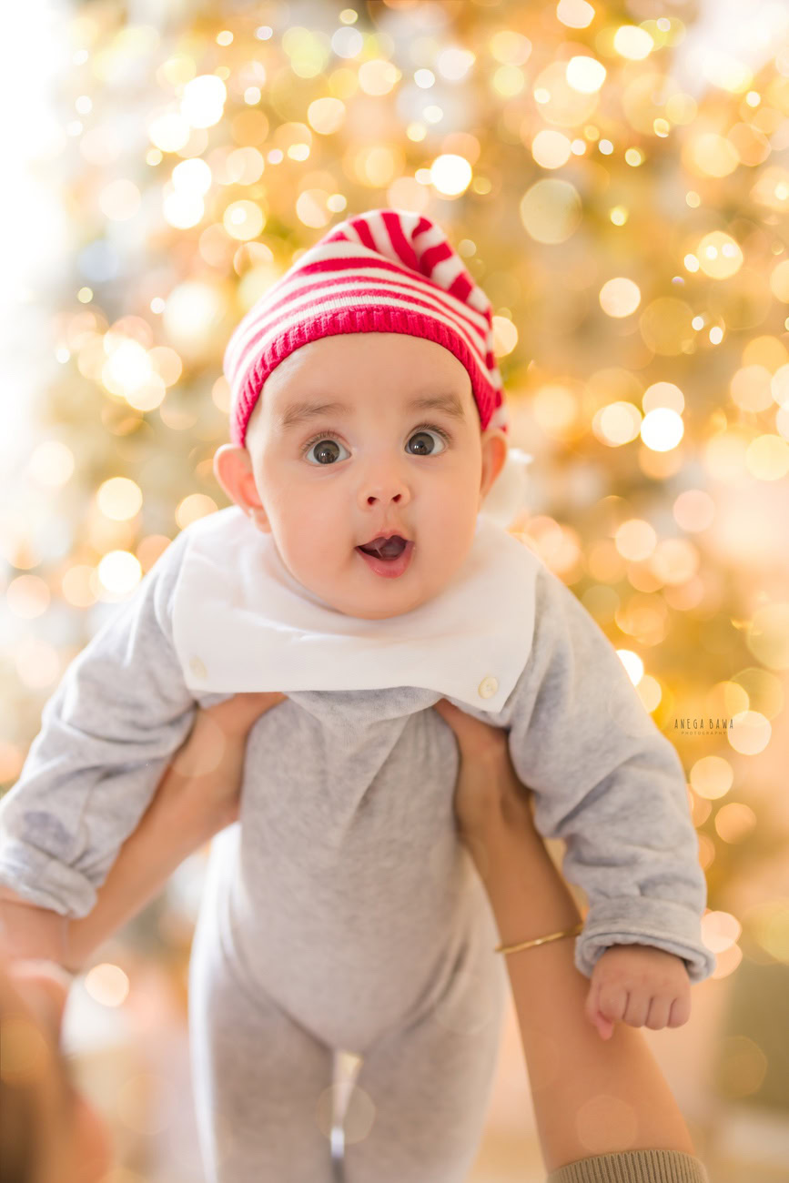 Baby boy photography, 5 or 4 or 3 or 6 months, Christmas tree, golden lights, Christmas cap. Location: Delhi, Gurgaon, Noida. Photographer: Anega Bawa.