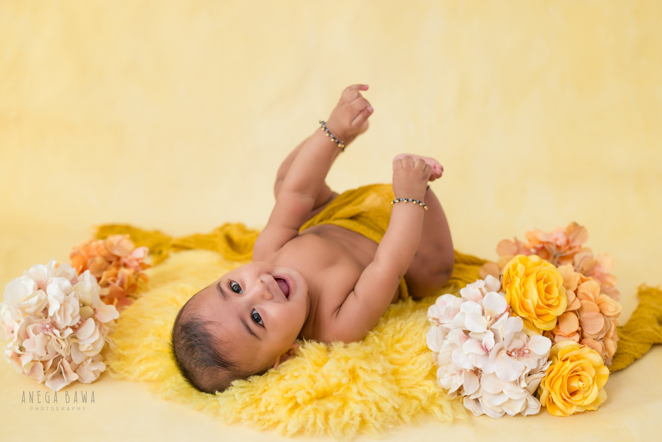 Baby boy photography, 5 or 4 or 3 or 6 months, yellow rug, yellow backdrop. Location: Delhi, Gurgaon, Noida. Photographer: Anega Bawa.