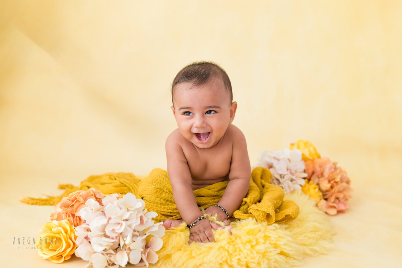 Baby boy photography, 5 or 4 or 3 or 6 months, yellow wrap, cute smiling seating pose. Location: Delhi, Gurgaon, Noida. Photographer: Anega Bawa.