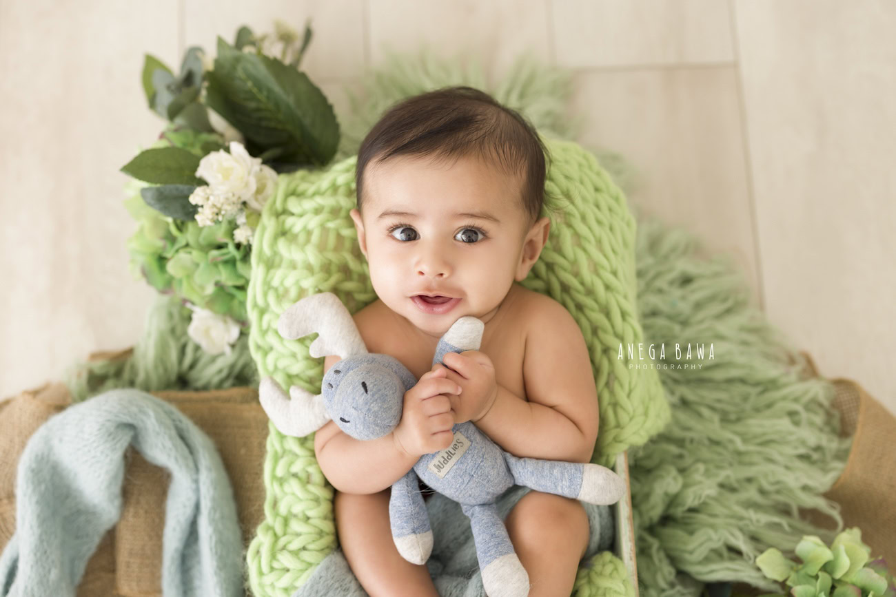 Baby boy photoshoot, 6, 5, 4, 3 months, green rug, soft toy, beige backdrop. Location: Delhi, Gurgaon, Noida. Photographer: Anega Bawa.